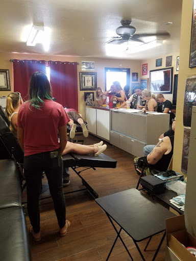 Explore five finger death punch tattoo ideas, creative tattoo ideas in Fort Mohave, available at RedRum Tattoo & Body Piercing Co.