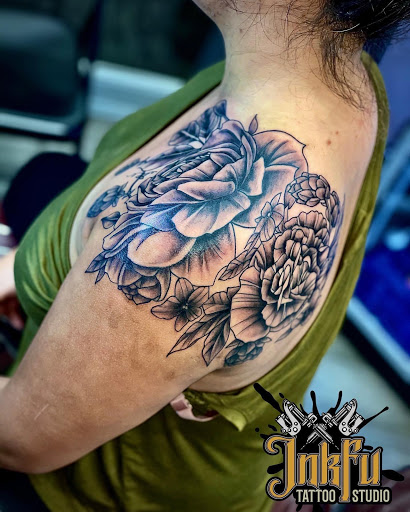 Explore december birth flower tattoo ideas, creative tattoo ideas in Omaha, available at Inkfu Tattoo Studio