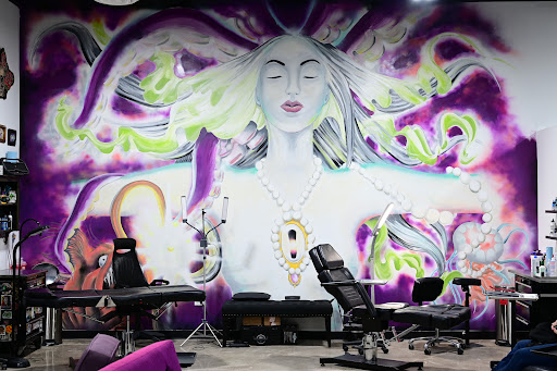 Find tattoo ideas for female chest for your next unique tattoo in Arlington at Lady Octopus Tattoos