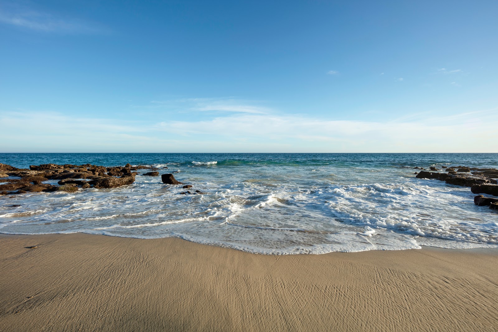Foto av East Cape Beach - populär plats bland avkopplingskännare
