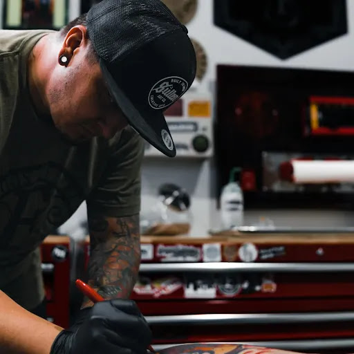 Explore calf tattoo ideas male, creative tattoo ideas in Wills Point, available at Tattanium Studios