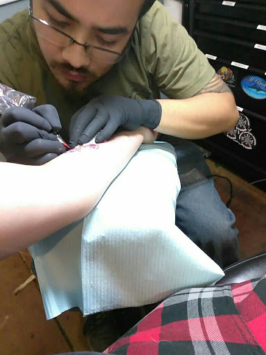 Explore dog paw tattoos ideas, creative tattoo ideas in Arlington, available at Urbans Tattoo & Piercing Studio