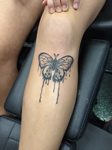 Explore skull hand tattoo ideas, creative tattoo ideas in Slippery Rock, available at Dinky Dachshund Tattoo Parlor
