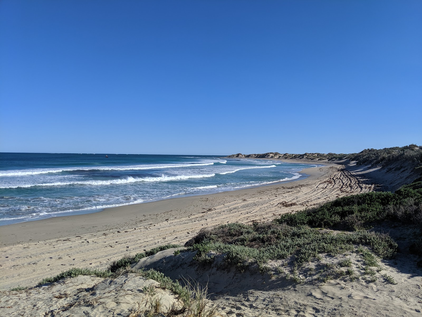 Fotografija Double Beach z svetel pesek površino