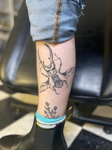 Explore banner tattoo ideas, creative tattoo ideas in Chatham, available at Gilded Lily Tattoo