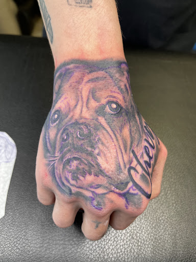 Explore hand tattoo ideas for men, creative tattoo ideas in Watford City, available at Soulful Ink Studios