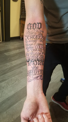 Explore leg tattoo ideas for men black, creative tattoo ideas in Roanoke, available at Skin Thrills Tattoo & Body Piercing Studio