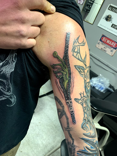 Explore olive branch tattoo ideas, creative tattoo ideas in Hudson Falls, available at ALTERED ADDICTION TATTOOS