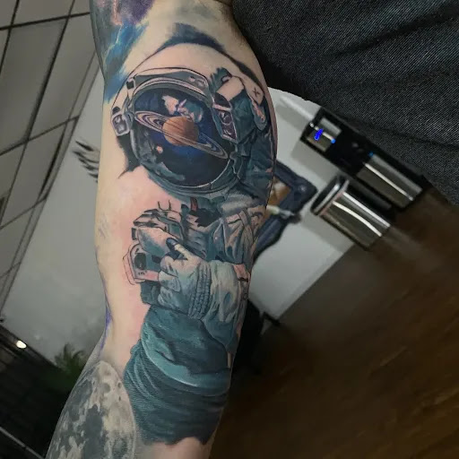 Explore bald head tattoo ideas, creative tattoo ideas in Katy, available at Family Tattoo Studio