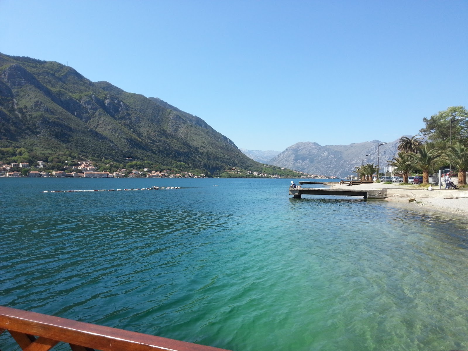 Photo of Kotor beach with turquoise pure water surface