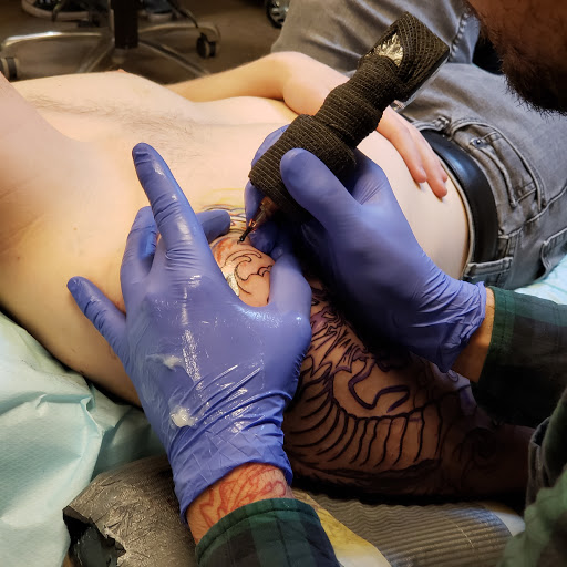 Explore vintage halloween tattoo ideas, creative tattoo ideas in Tea, available at Red Arbor Tattoo