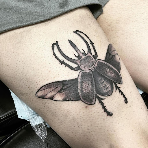 Find background tattoo ideas for guys for your next unique tattoo in Saint Paul at Black Coffin Tattoo