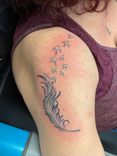 Explore electric guitar tattoo ideas, creative tattoo ideas in Palm Harbor, available at Angry Owl Tattoo and Piercing
