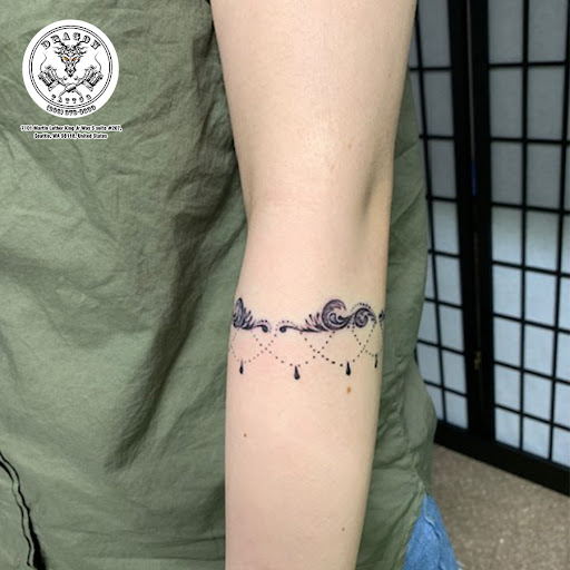 Explore charm tattoo ideas, creative tattoo ideas in Seattle, available at Dragon Tattoo