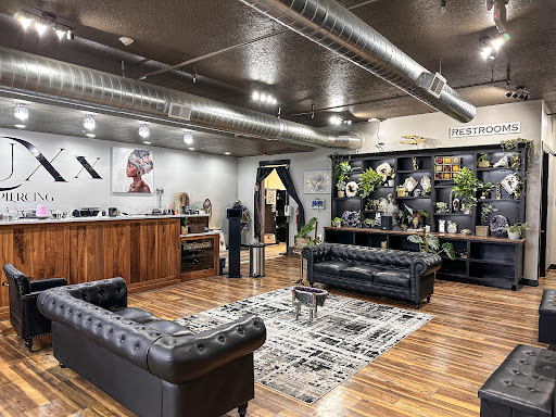 Explore open book tattoo ideas, creative tattoo ideas in Ogden, available at LuXx Piercing iNcisioN Piercing