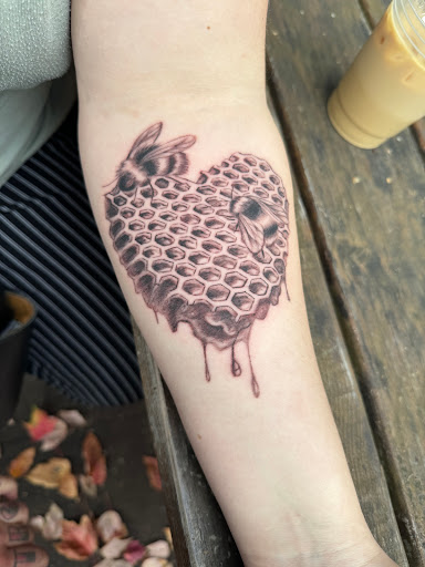 Explore red ink tattoo ideas, creative tattoo ideas in Vancouver, available at Sacred Yeti Tattoos