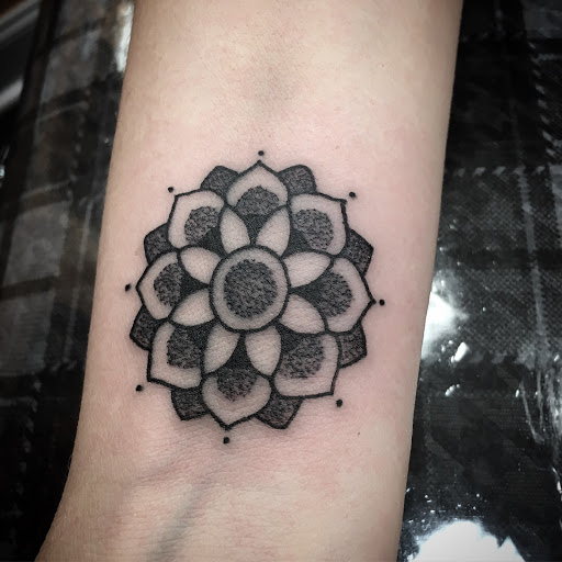 Explore dirtbike tattoo idea, creative tattoo ideas in Annapolis, available at Lucky Bird Tattoo