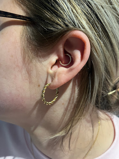 Explore cover up tattoo ideas lower back, creative tattoo ideas in Evansville, available at Evil Twins Piercing Studio