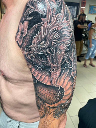 Find angel tattoo ideas for females for your next unique tattoo in Sarasota at SEVEN SINS Tattoo Studio