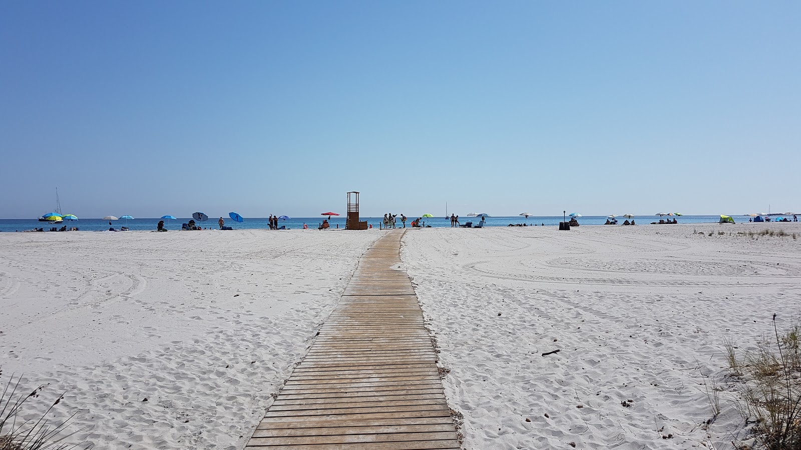 Valokuva Spiaggia Di Capo Cominoista. ja asutus