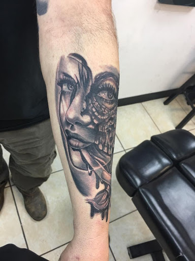 Explore male hand tattoo ideas, creative tattoo ideas in Harrisonburg, available at Dreamland Tattoo