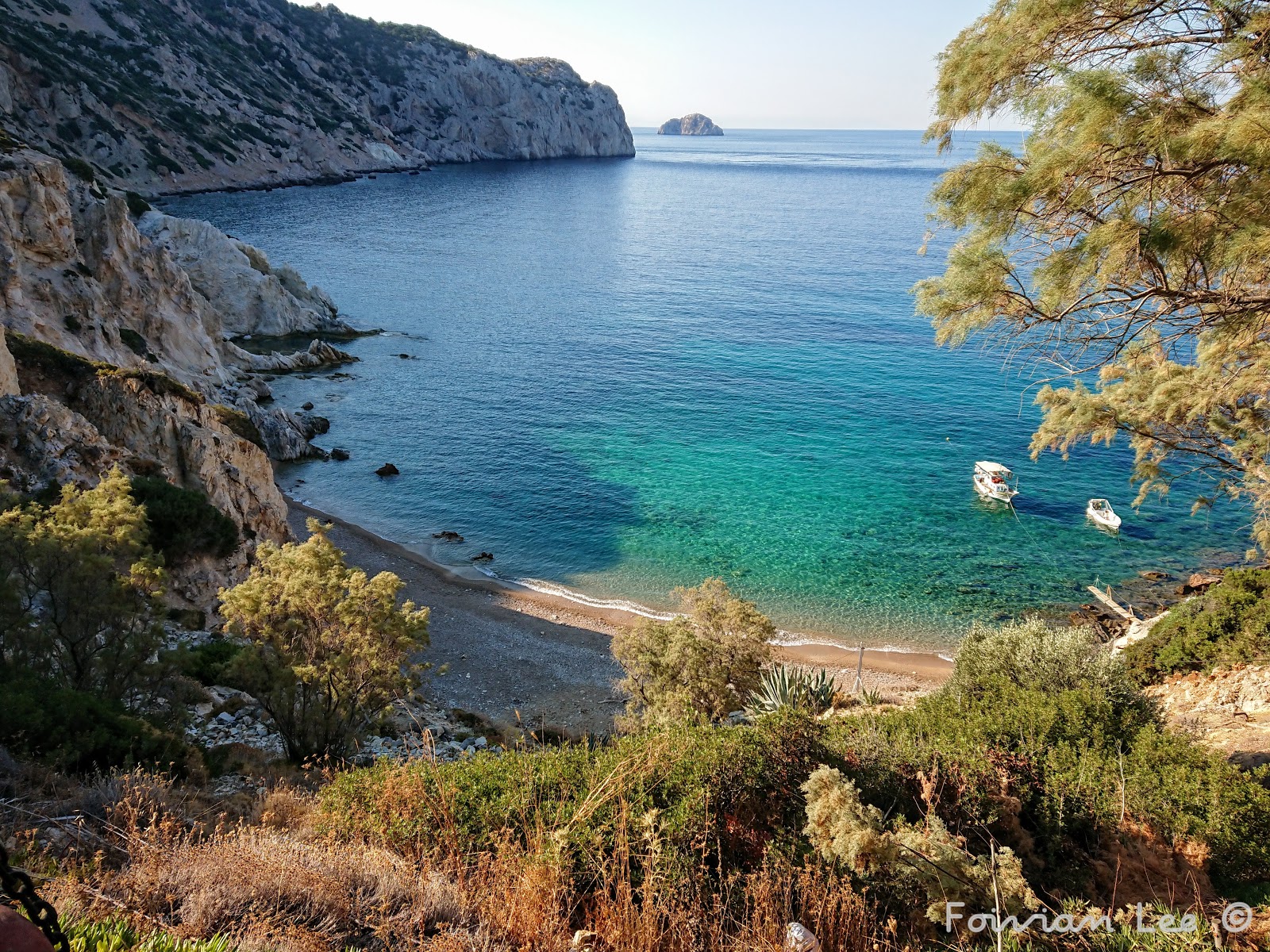 Photo of Paralia Vroulidia with turquoise pure water surface