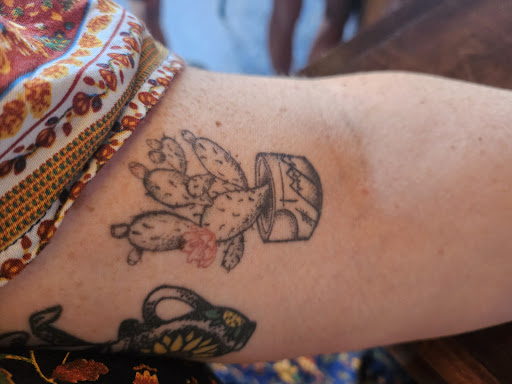 Explore floral tattoo filler ideas, creative tattoo ideas in Stephenville, available at Ghost Ink Tattoo & Piercing Studio