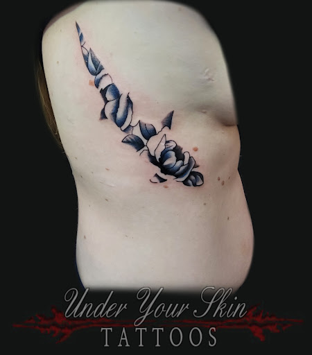 Explore back tattoo ideas for guys, creative tattoo ideas in Green Cove Springs, available at Under Your Skin Tattoos