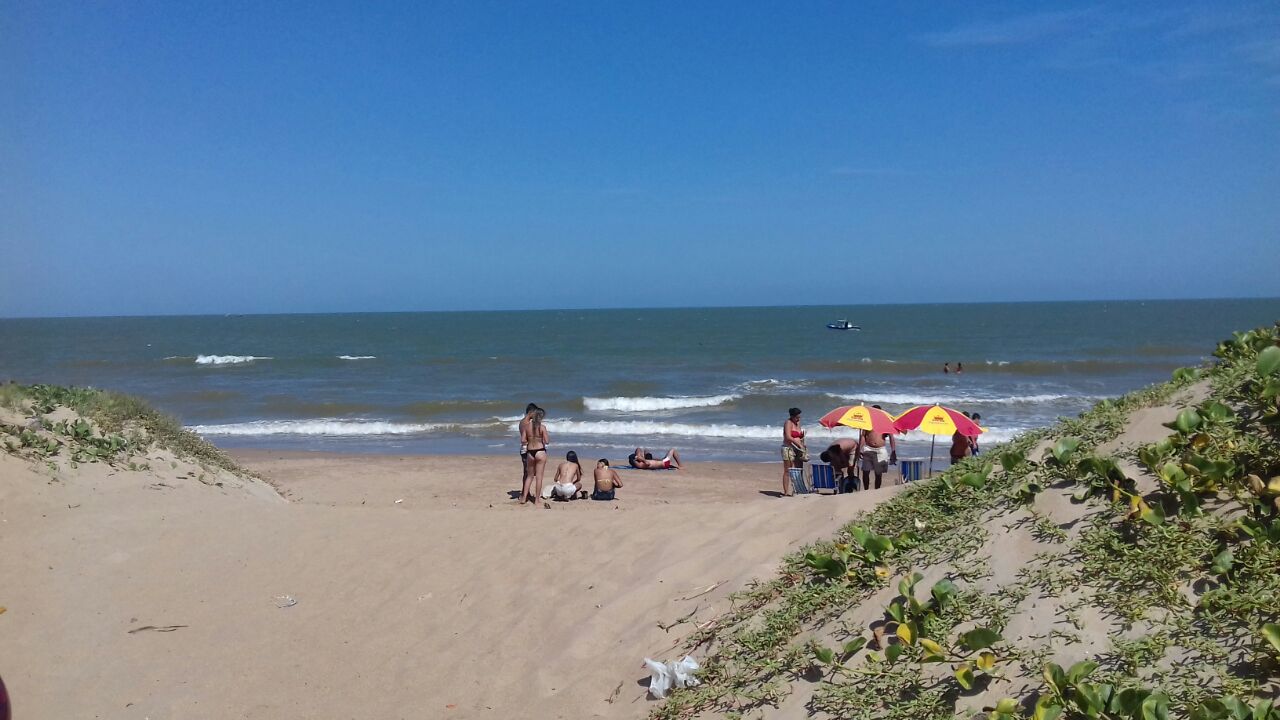 Foto von Sossego Strand und die siedlung