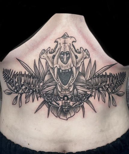 Explore middle neck tattoo ideas, creative tattoo ideas in Cocoa, available at Rorschach Tattoo Shop and Piercing Studio