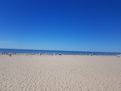Foto di Sunset beach con costa lunga e dritta