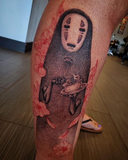 Explore lower back tattoo cover up ideas, creative tattoo ideas in Palm Harbor, available at Angry Owl Tattoo and Piercing