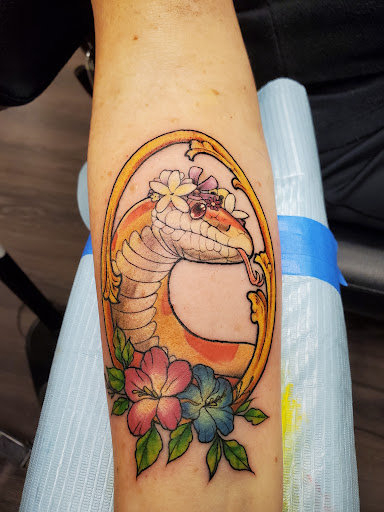 Explore cross with names tattoo ideas, creative tattoo ideas in Peoria, available at Guerrilla Ink Tattoos