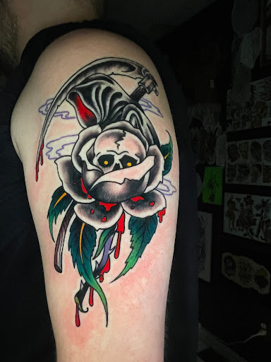 Explore rip cross tattoo ideas, creative tattoo ideas in Georgetown, available at Iron Rite Tattoo South