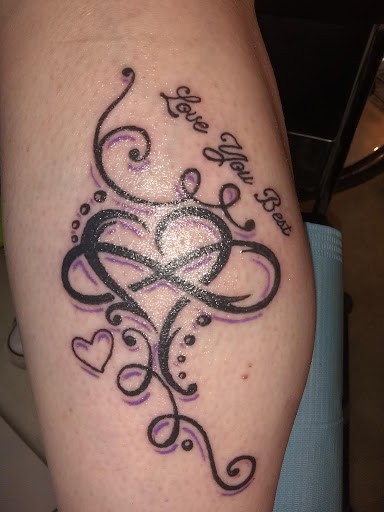 Explore knee cap tattoo ideas for men, creative tattoo ideas in Peoria Heights, available at Twisted Vision Inc