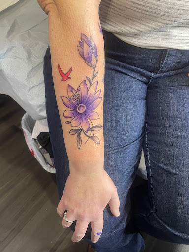 Explore lion forearm tattoo ideas, creative tattoo ideas in Orange Park, available at Big City Tattoo and Piercing