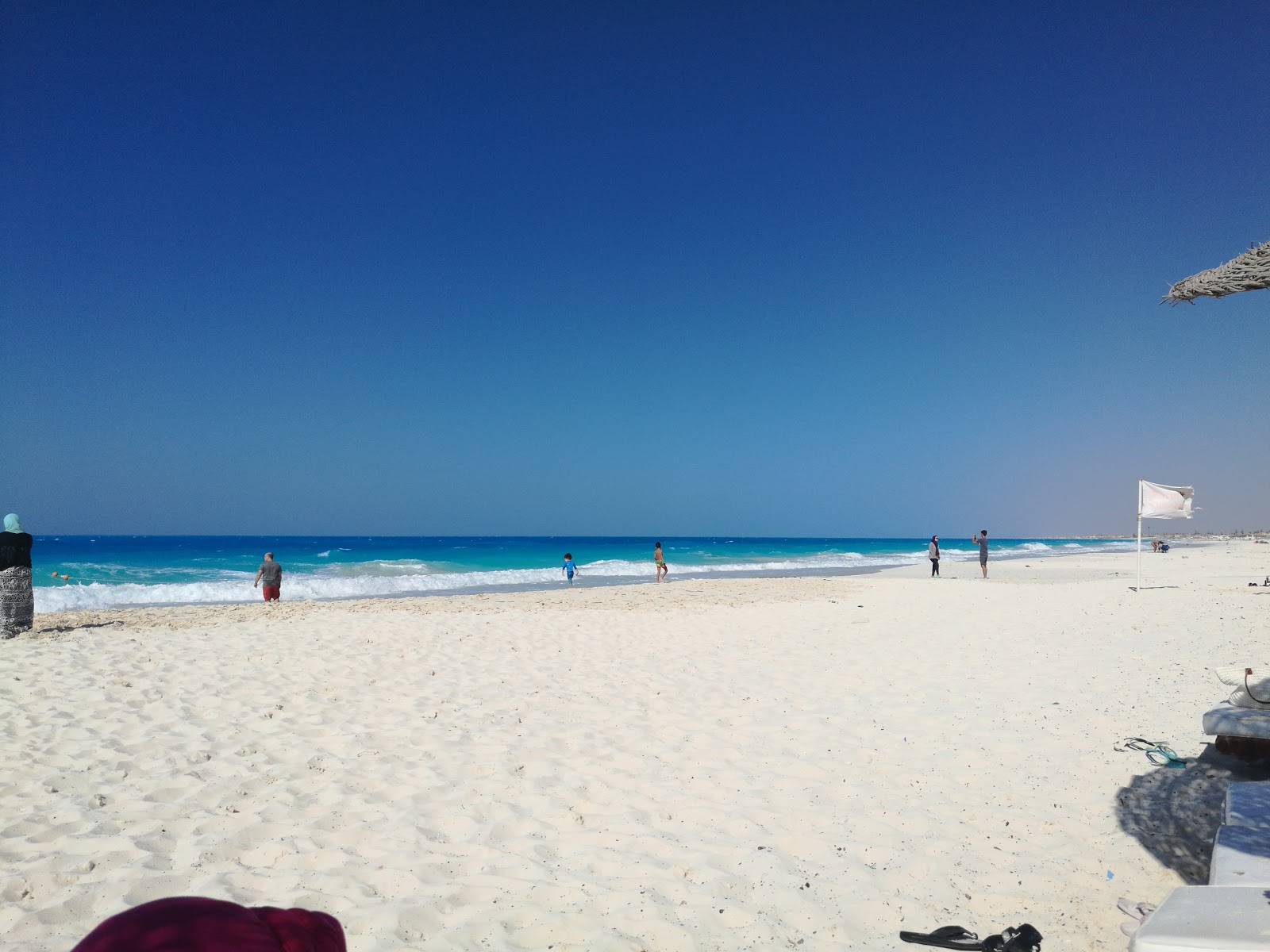 Foto van Assiut University Beach met wit zand oppervlakte