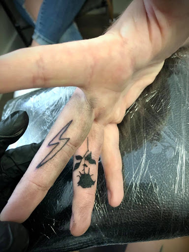 Explore cardinal tattoo ideas, creative tattoo ideas in Warrensburg, available at Altered Visions Tattoo Studio