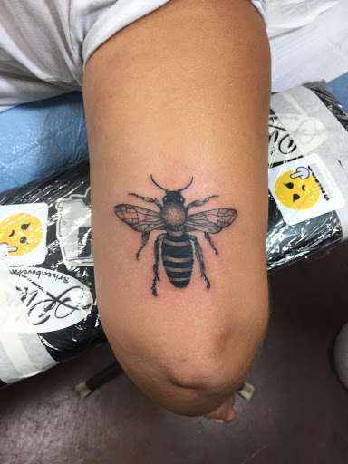 Explore side hand tattoo ideas, creative tattoo ideas in Montclair, available at Rise Above Tattoo Co.