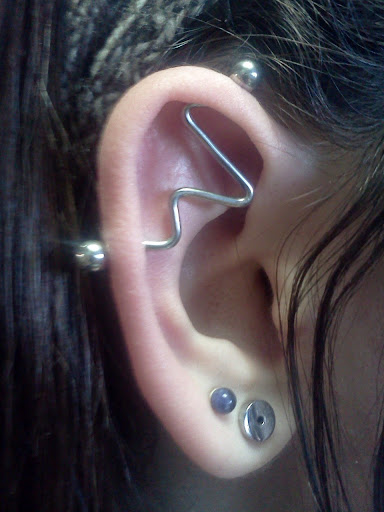 Find tattoos ideas on leg for your next unique tattoo in Summerville at Exotic Impressions Body Piercing