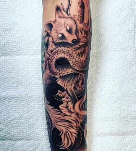 Explore thigh tattoo ideas for men, creative tattoo ideas in Daytona Beach, available at Studio 21 Tattoo & Piercings Daytona Beach