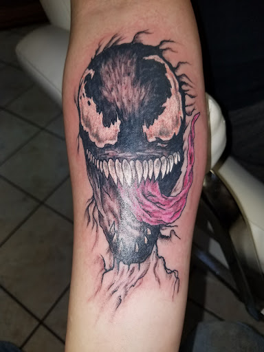 Explore weightlifting tattoos ideas, creative tattoo ideas in Johnstown, available at Screaming Needle Tattoo & Body Piercing