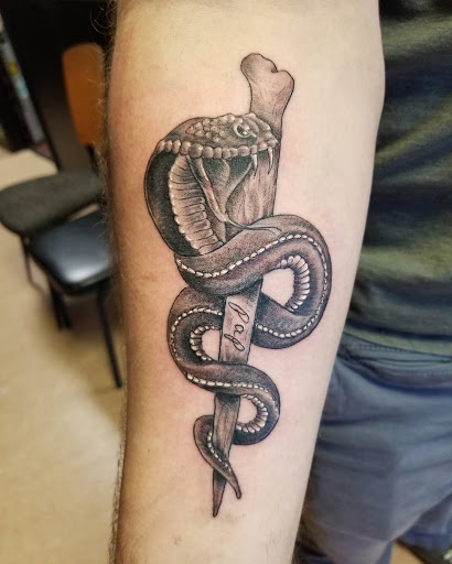 Explore hand skull tattoo ideas, creative tattoo ideas in Orange Park, available at Big City Tattoo and Piercing