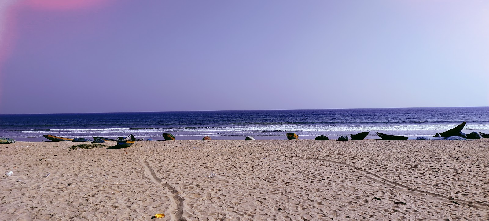 Foto av KR Peta Beach med turkos rent vatten yta