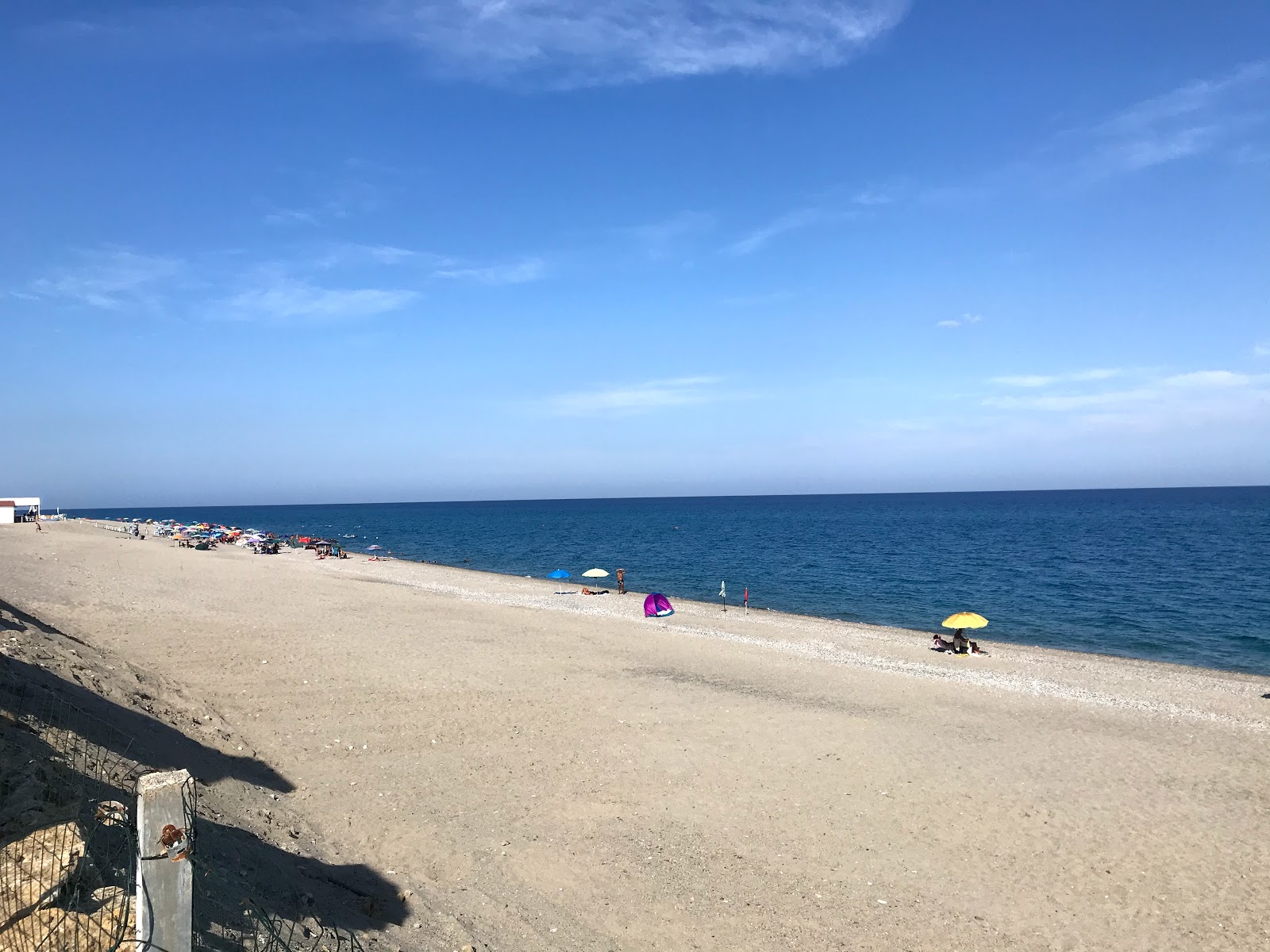 Foto av Torre Ellera beach med lång rak strand