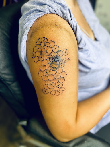 Explore man hand tattoo ideas, creative tattoo ideas in Lake City, available at Crooked Spines Tattoo Studio