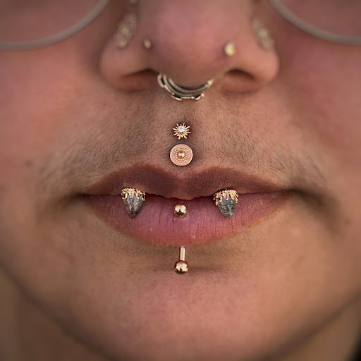 Find skull tattoo ideas for females for your next unique tattoo in Corona Del Mar at Rainbow Piercing & Jewelry