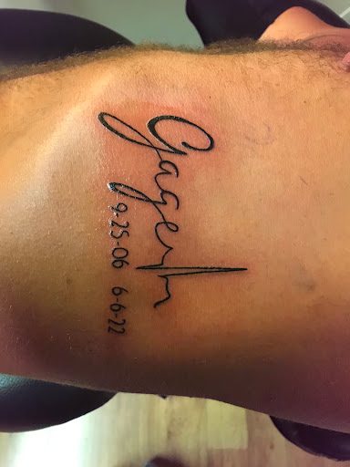 Explore rip cross tattoo ideas, creative tattoo ideas in Owensboro, available at BnB Tattoos & Piercings