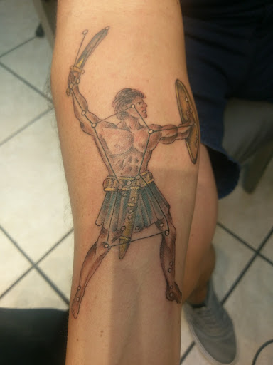 Explore open book tattoo ideas, creative tattoo ideas in Neptune, available at Neptune Tattooville