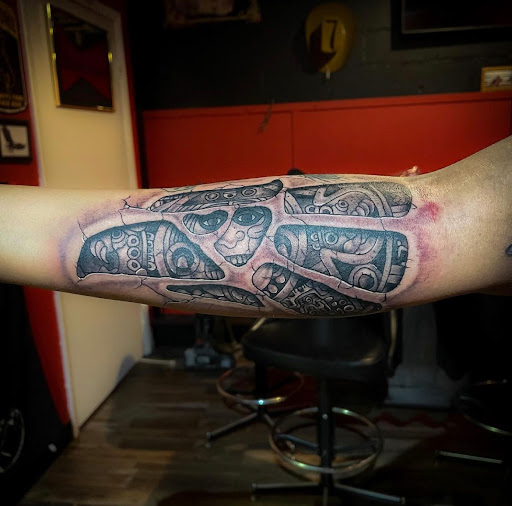 Find small wolf tattoo ideas for your next unique tattoo in Lander at Blackblood Tattoo and Piercing